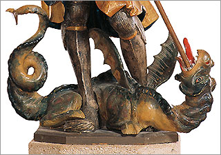 Bild: Der Drache wird vom heiligen Georg getötet (Detail einer Holzskulptur).